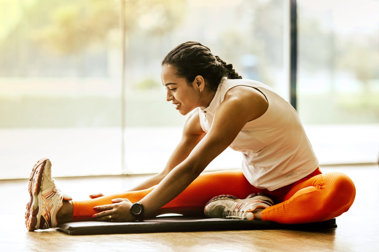 Woman stretching on ground